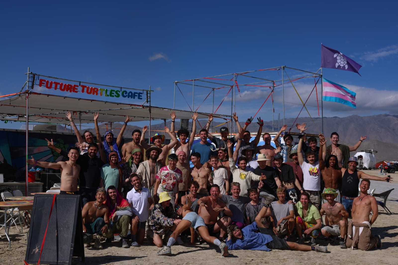posed photo of all the turtles in front of their camp